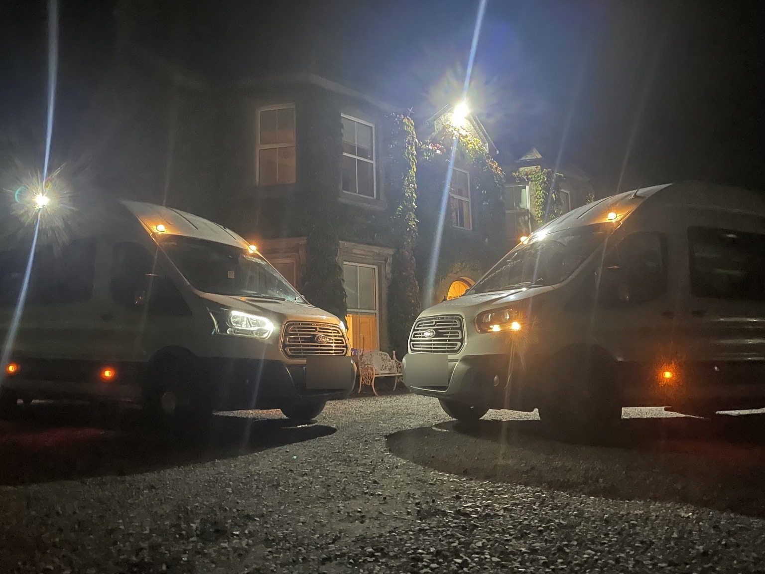 Paul Murphy Bus Hire vehicles at night
