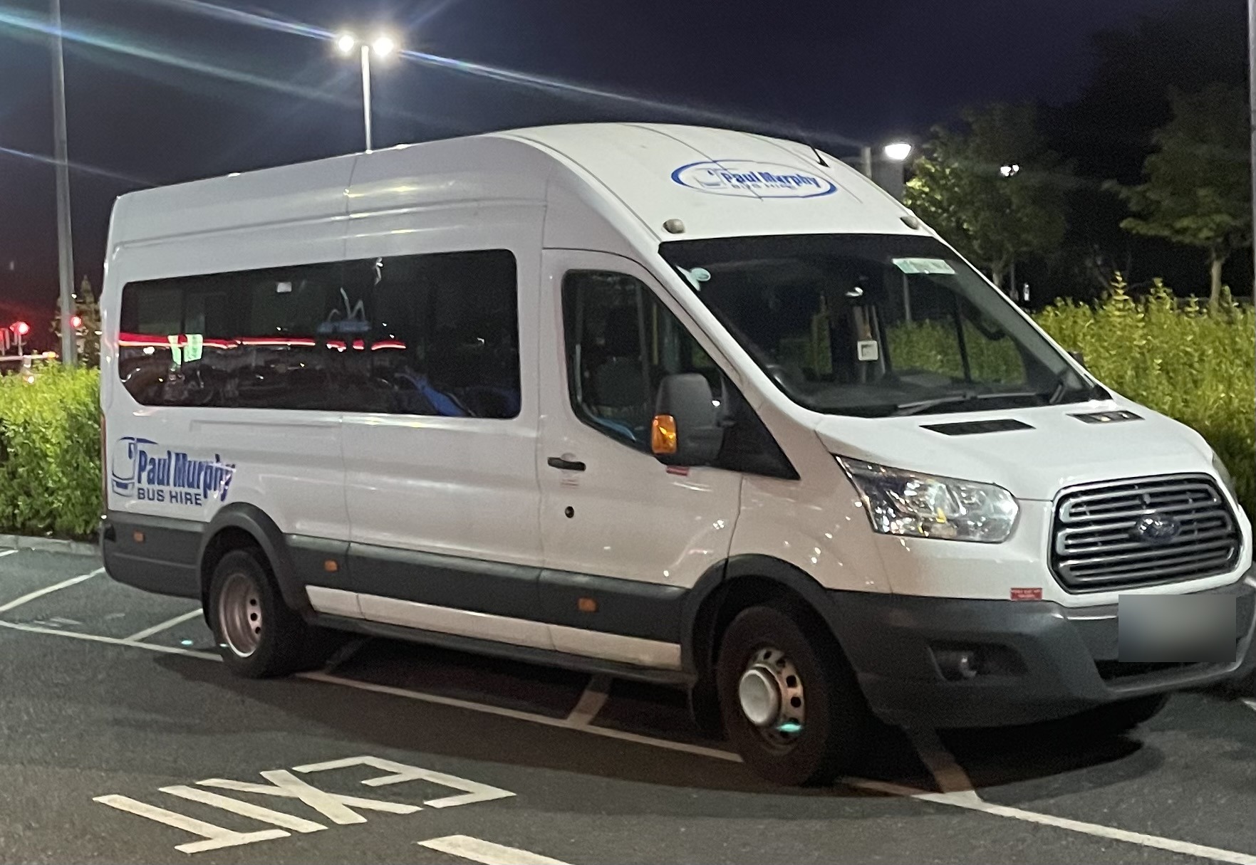 White Ford minibus