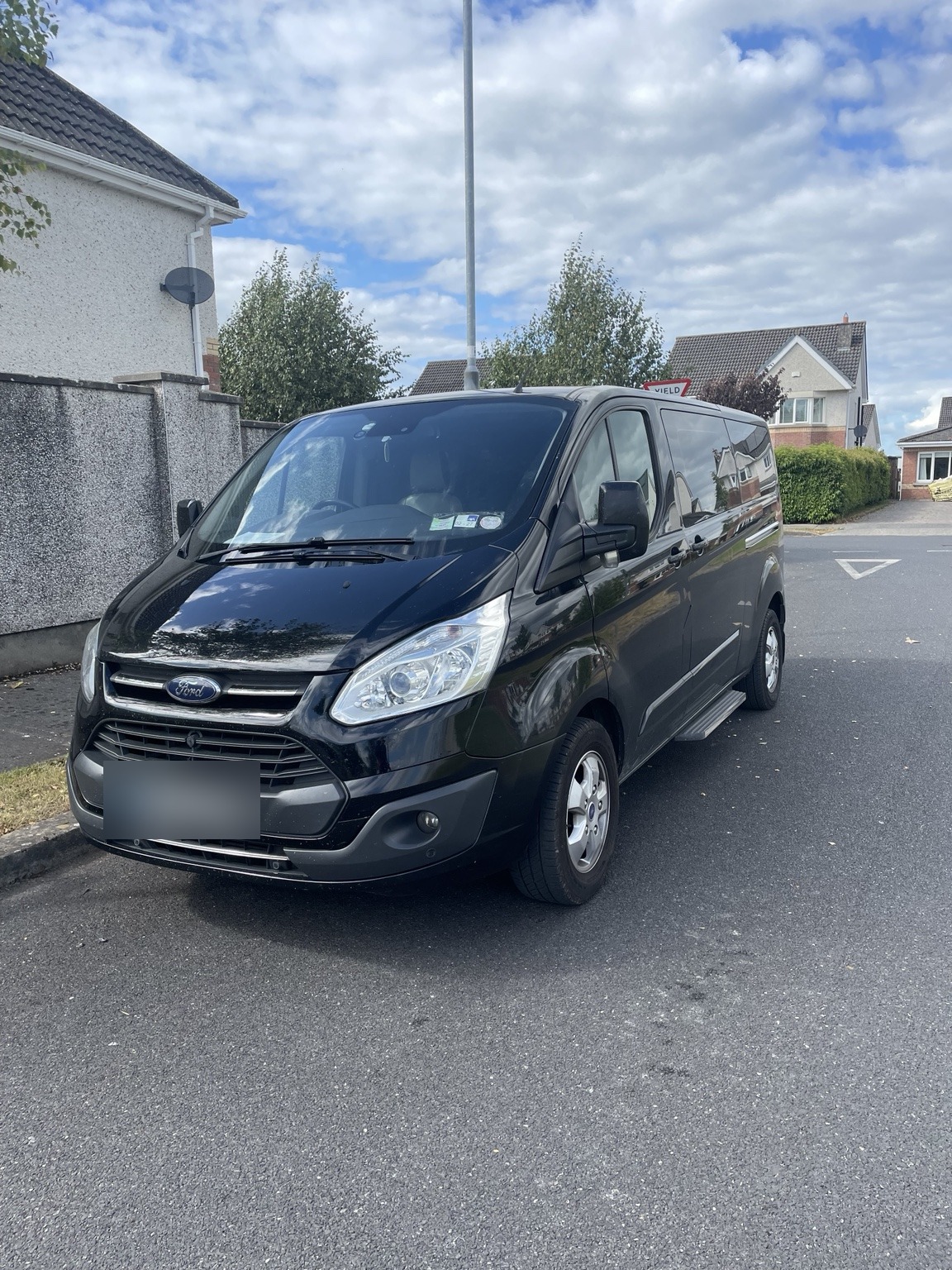 Black Ford minibus